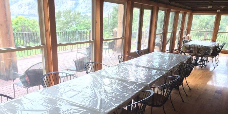 Extensive dining area for large teams on the porch at the Lodge at Palmer Lake